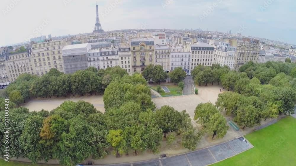 Cityscape with Eiffel Tower and houses near park Cityscape with Eiffel Tower and houses near park