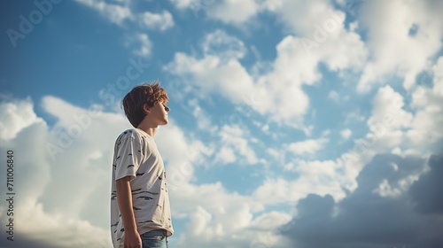 Boy looking up at the sky