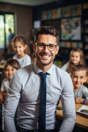 Male teacher with elementary students in classroom