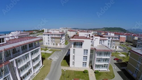 Houses of town-hotel Barhatnye Sezony near sea shore at summer photo