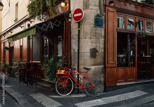 Cozy street with old bicycle in Paris, France. Architecture and landmarks of Paris. Postcard of Paris