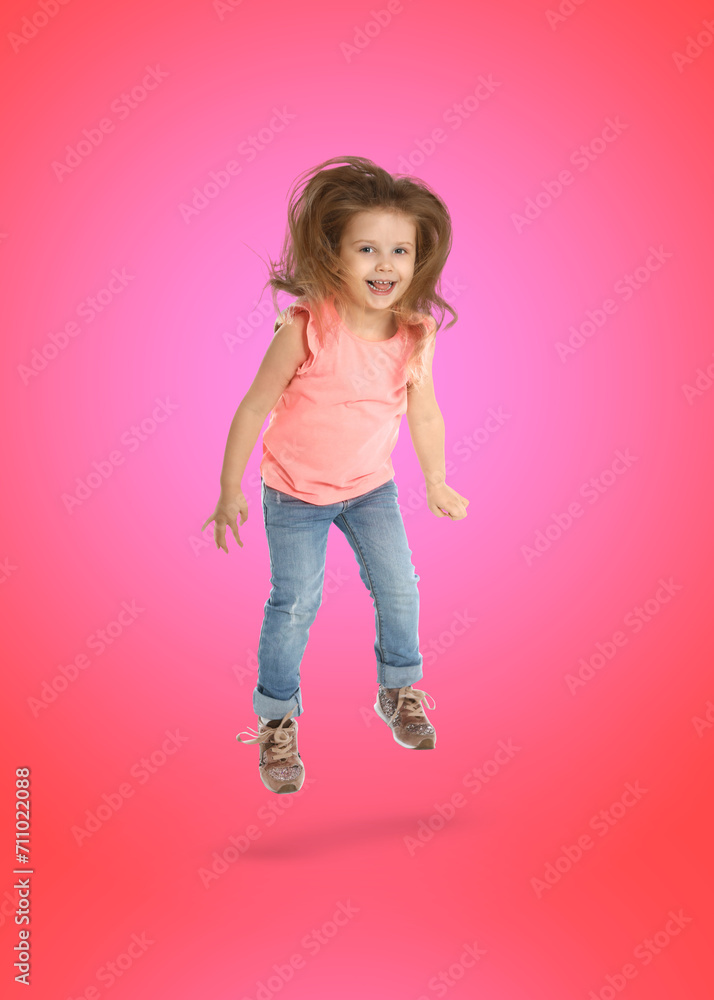 Happy cute girl jumping on color gradient background Happy cute girl jumping on color gradient background