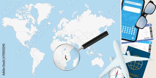Malawi is magnified over a World Map, illustration with airplane, passport, boarding pass, compass and eyeglasses. photo
