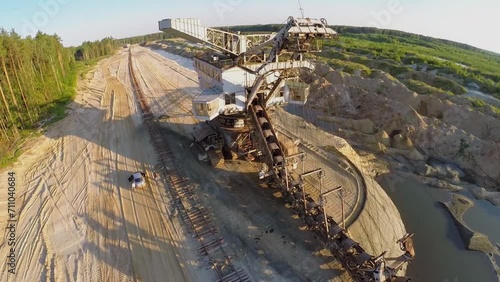 People get out from car at sandpit with railway and absetzer photo