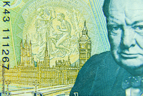 London, UK, 2 January 2024: British five pounds sterling banknote  closeup with selective focus. Portrait of Sir Winston Churchill, Prime Minister of the United Kingdom  photo