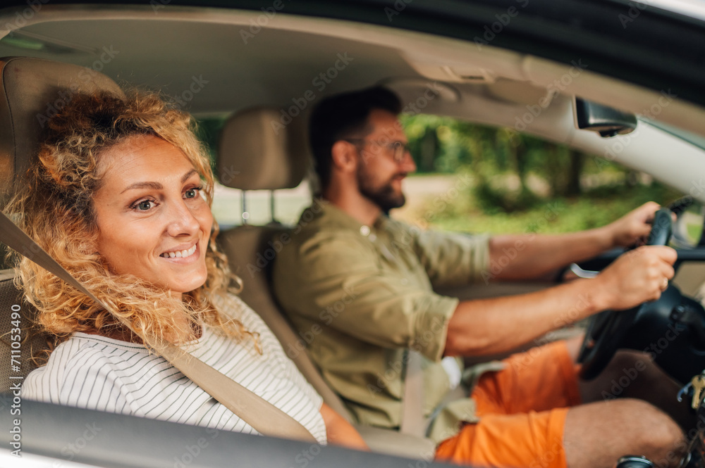 Mother sitting on a passenger seat of a car while traveling with her family Mother sitting on a passenger seat of a car while traveling with her family