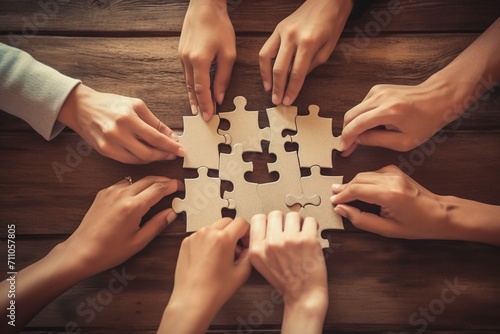 Diverse group of people putting puzzle pieces together photo