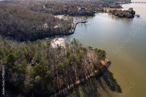 Warm afternoon sunlight over Mcdowell nature preserve and Lake Wylie in Charlotte, North Carolina from above photo