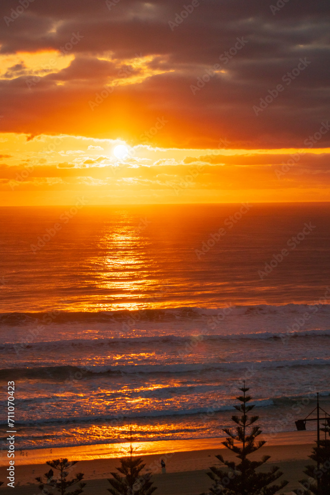 Fototapeta premium Golden Sunrise Over Gold Coast Beach