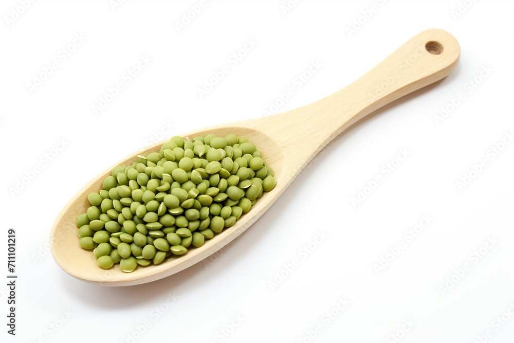 close up the green mung beans in wooden spoon on white background close up the green mung beans in wooden spoon on white background
