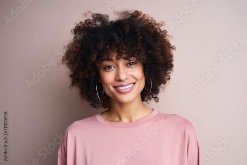 Portrait of a beautiful young african american woman with curly hair © Iigo