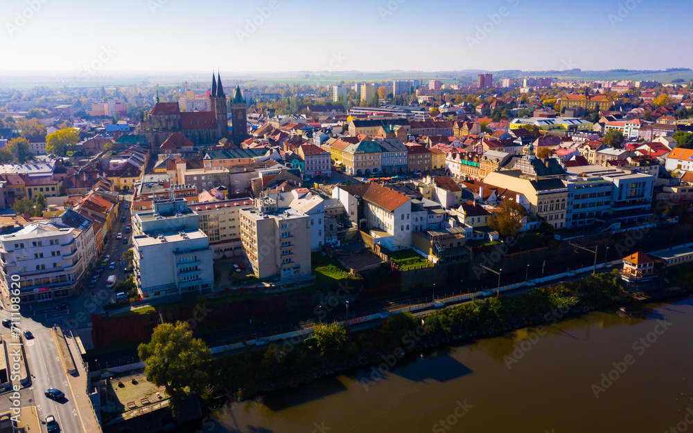 Aerial view of autumn Kolin cityscape on Elbe River overlooking medieval Gothic Cathedral of St. Bartholomew, Czech Republic