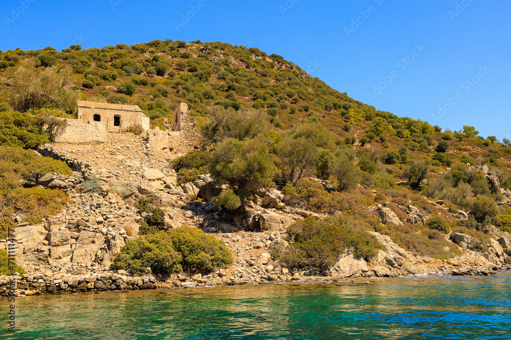 Naklejka premium Antique ruins of an ancient city on the island. Background with selective focus and copy space