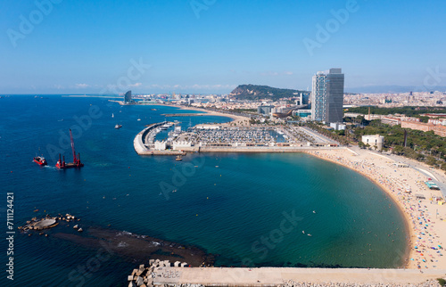 Photography Aerial panoramic view of modern Barcelona cityscape on Mediterranean coast overl
