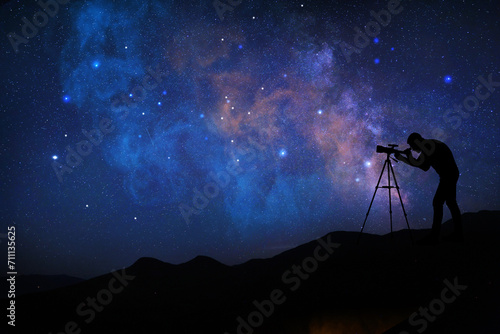 Astronomer looking at starry sky through telescope outdoors. Space for text