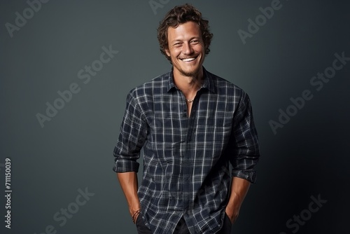 Portrait of a handsome young man smiling at the camera. Men's beauty, fashion.