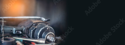 Banner Mechanic tools engineering equipment car auto repair shop with copy space. Blurred background mechanical service. Banner Heavy screw grungy rusted dirty object black background with copy space