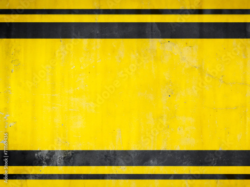 yellow grunge concrete wall background.