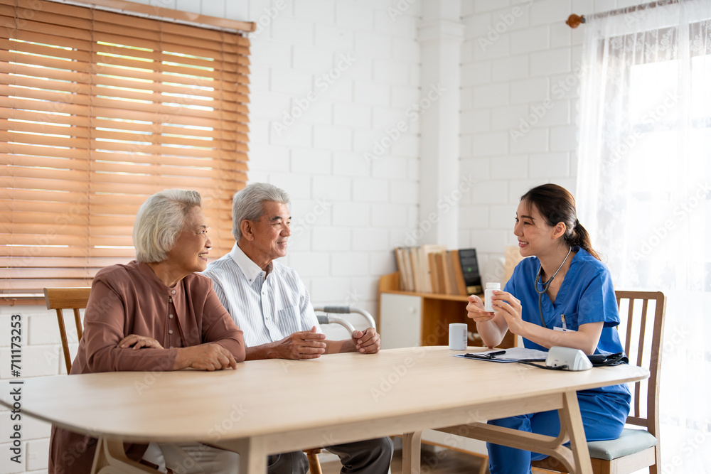 Asian caregiver nurse examine senior man and woman patient at home. Asian caregiver nurse examine senior man and woman patient at home.