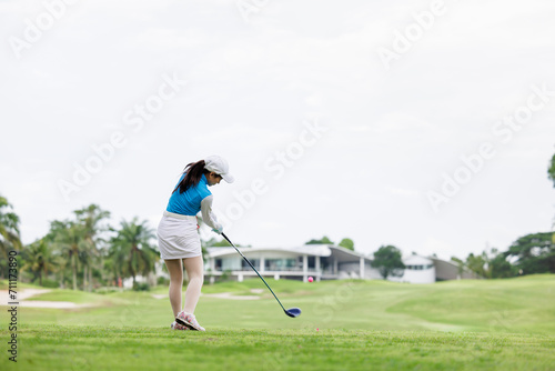 Professional woman golfer practice in golf course