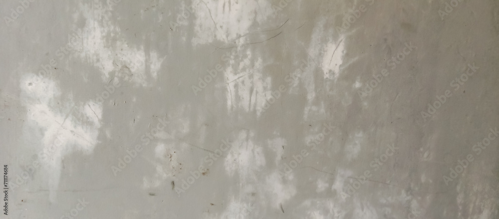 Fototapeta premium The texture of the old cement wall of gray paint, the background texture of the old cement wall of gray paint,