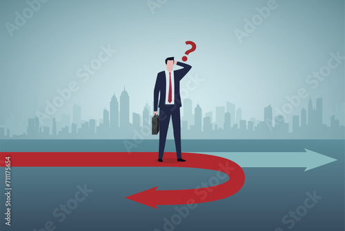 Business turning point, break event or change direction, reverse back, interest rate or financial trend change concept, frustrated businessman investor looking at his reverse direction pathway. 