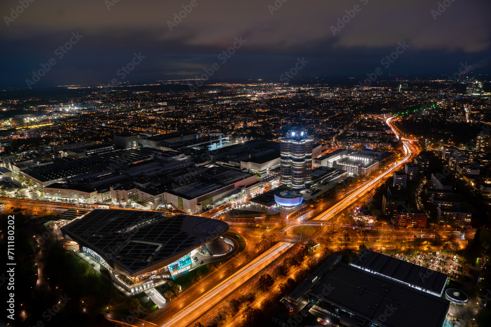 Munich Urban Nightscape: Illuminated Skyline and Moving Lights