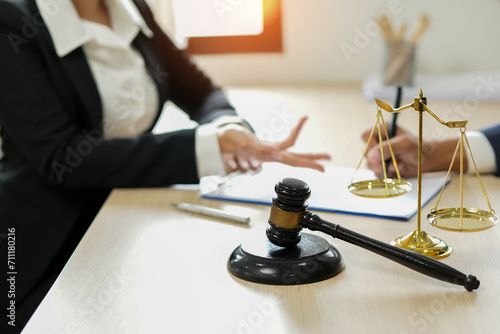 judge on wooden table And experienced lawyers meet with clients and give advice behind the scenes. legal services legal consulting concept