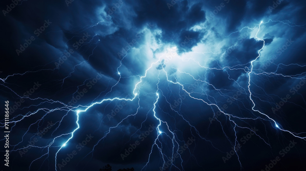 The night sky is dramatically lit by the intricate dance of vivid lightning bolts during a powerful thunderstorm. The night sky is dramatically lit by the intricate dance of vivid lightning bolts during a powerful thunderstorm.