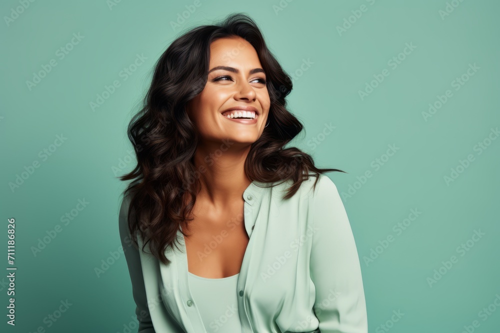 Portrait of happy smiling beautiful young brunette woman in green blouse Portrait of happy smiling beautiful young brunette woman in green blouse