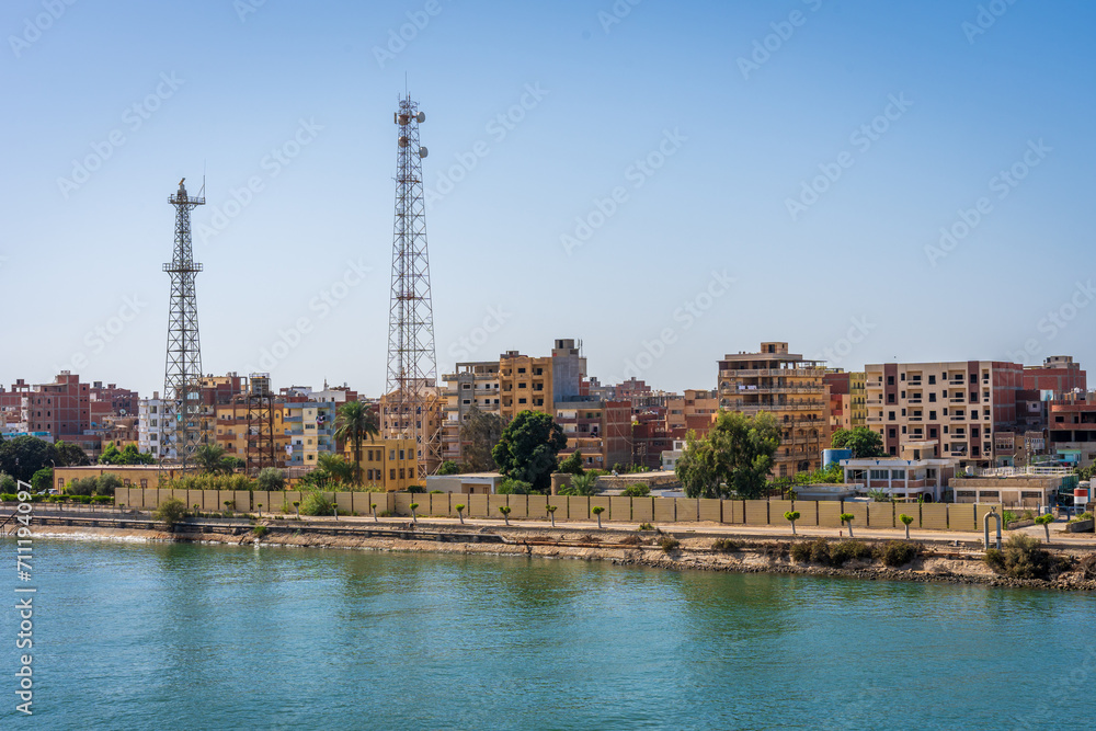 City along the Suez Canal in Egypt with the water in the foreground