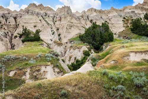 Deep ravine in the arid desert canyon landscape of the Badlands National Park of South Dakota during early summer.