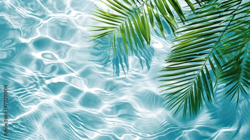 Spa concept with a palm leaf in wavy water. Abstract, transparent tropical water texture surface with palm leaves. top view, beauty backdrop, mockup, spa and wellness, copy space © ND STOCK