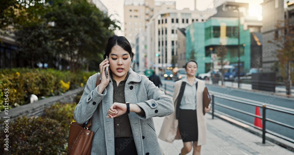 Phone call, watch and Japanese businesswoman in city, late for work on Tokyo street or sidewalk. Stress, time and schedule with young professional employee walking on road in rush for appointment