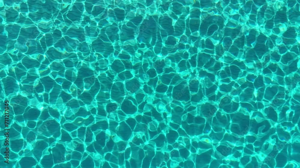 Turquoise water of the Mediterranean sea with a sandy bottom. Aerial top down view of transparent blue sea water with reflections of sun rays Turquoise water of the Mediterranean sea with a sandy bottom. Aerial top down view of transparent blue sea water with reflections of sun rays