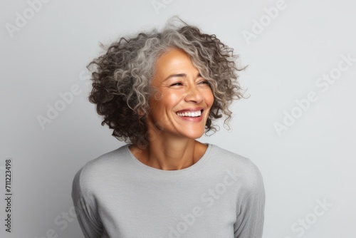 Close up portrait of a happy african american woman laughing and looking at camera