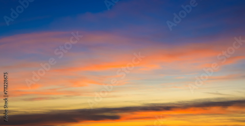 Sunset Sky with Twilight in the Evening as the colors of Sunset Cloud Nature as Sky Backgrounds, Horizon scene. © SASITHORN