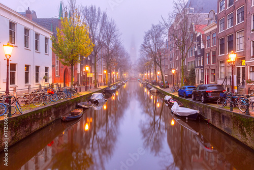 Amsterdam canal Groenburgwal with Zuiderkerk, southern church, Holland, Netherlands. © Kavalenkava