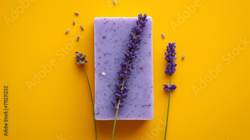 Organic handmade lavender soap on yellow background photo