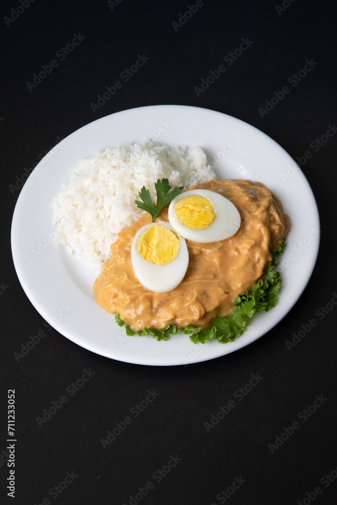 Aji de gallina chicken spicy cream served with rice traditional peruvian food