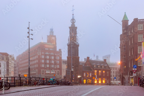 Tower Munttoren at Foggy morning in Amsterdam , Holland, Netherlands.