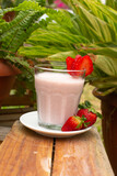 Strawberry smoothie with milk served in a glass beverage breakfast