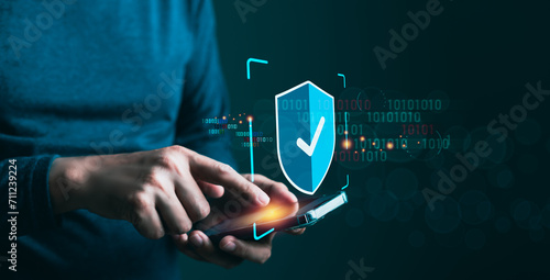Tableau sur toile Man's hand confidently touching symbols of digital safeguarding means cybersecur