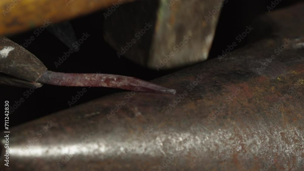 Close-up of a piece of metal, hammered on the anvil. Close-up of a piece of metal, hammered on the anvil.