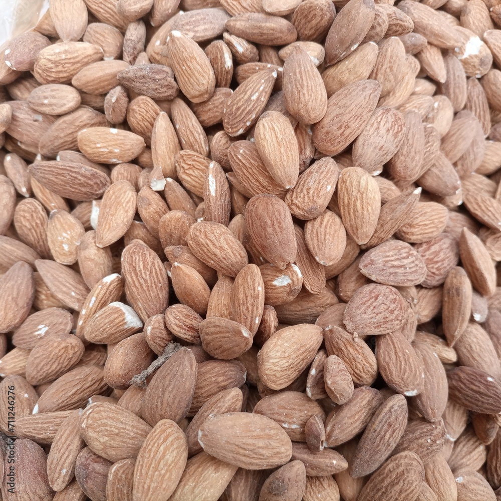 Fototapeta premium Close up of almonds. Almond texture macro almond brown almond.