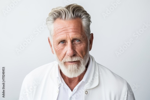 Portrait of senior man looking at camera. Isolated on white background.