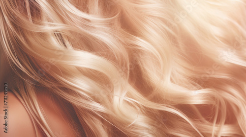 A close-up of flowing blonde hair  capturing the texture and movement with a soft-focus effect.