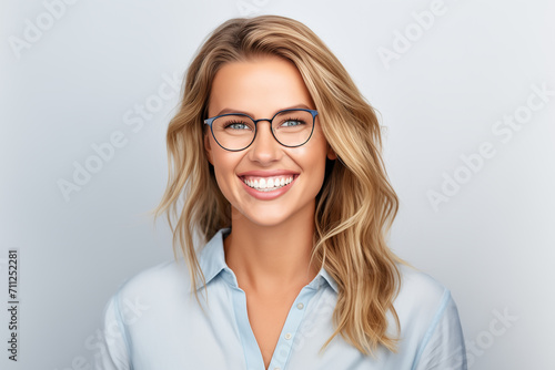 A photo portrait of a beautiful blonde with glasses over 30 years old, smiling 