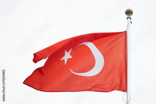 Flag of Turkey. A large Turkish flag flutters in the wind. Close-up. Great for news. Turkey flag on white background