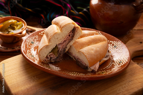 Mexican ham sandwich, in Mexico it is called Torta de Jamon, it is the most popular of the Mexican Tortas and the recipe varies depending on who prepares it, made with bolillo o telera bread. photo